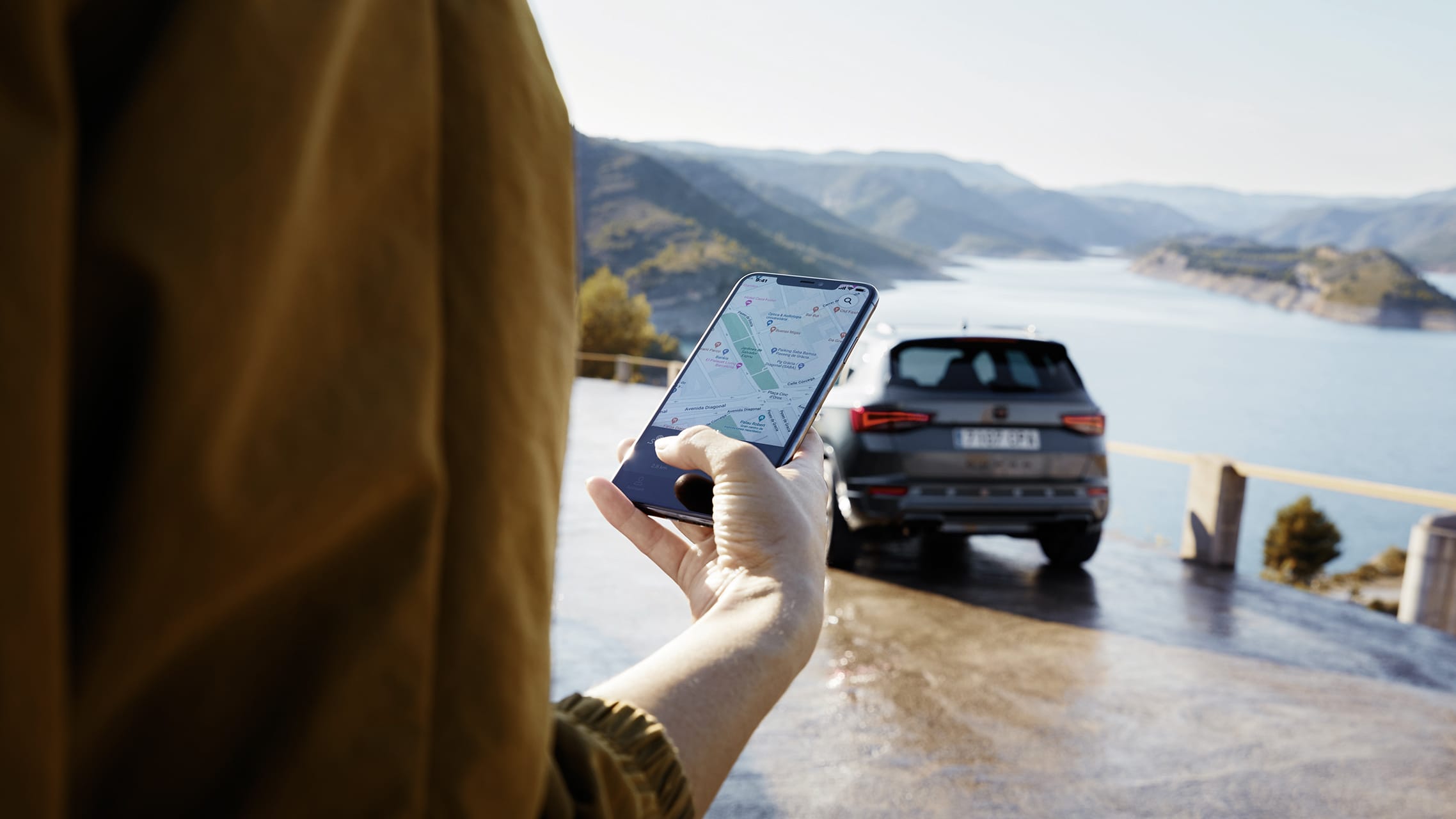 woman connected to cupra connect via smartphone